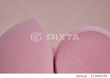 The texture of makeup sponges on a pink background. The texture of makeup sponges on a pink background. 123668299