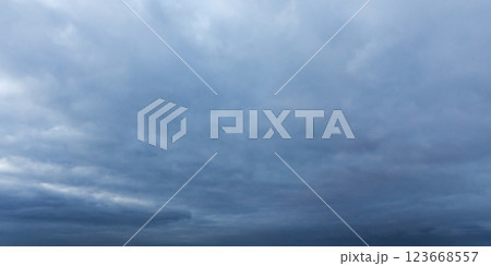Gentle and soft clouds covering dark sky. Background photo texture Gentle and soft clouds covering dark sky. Background photo texture 123668557