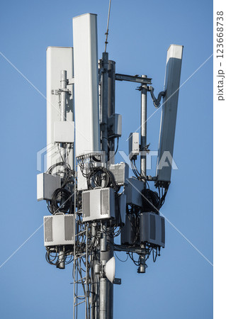 A telecommunications cell tower featuring multiple antennas 123668738