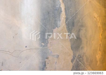 Textured surface featuring an abstract interplay of yellow and gray 123669063