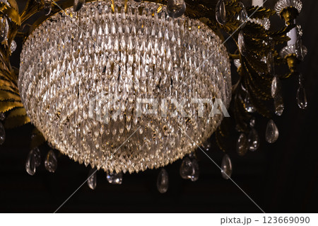 An ornate crystal chandelier showcases its intricate design 123669090