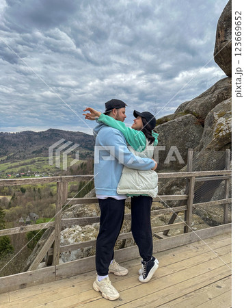 Couple Embracing with Scenic Mountain View 123669652