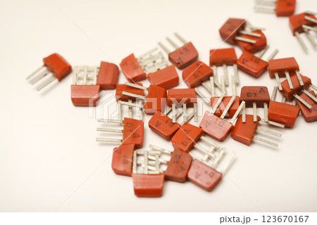Old transistors on a white background. Electronic elements. 123670167