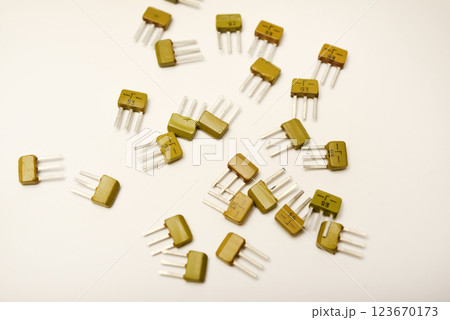 Old transistors on a white background. Electronic elements. 123670173