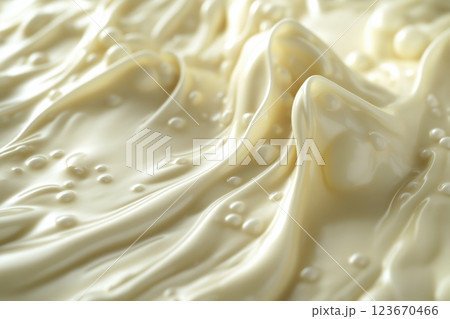 Luscious melted white chocolate flowing smoothly with rich, silky texture and sheen Luscious melted white chocolate flowing smoothly with rich, silky texture and sheen 123670466