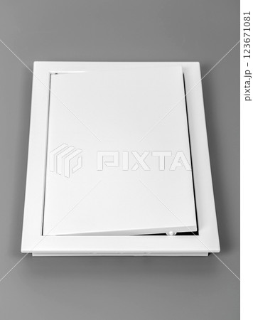 White plastic hatch on a gray background. Rectangular shape. White plastic hatch on a gray background. Rectangular shape. 123671081