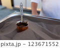 Coffee is made on the sand. Coffee is made on the street for tourists on the sand. 123671552