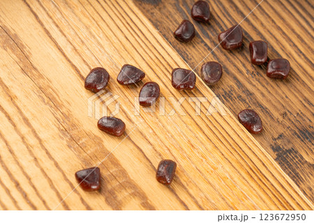 Dried tamarind seeds isolated, Tamarindus indica beans on a white background, medicine ingredient 123672950
