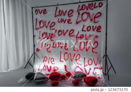 word love written on a plastic bag with an aerosol can. zone for Valentine's Day on white background word love written on a plastic bag with an aerosol can. zone for Valentine's Day on white background 123673270