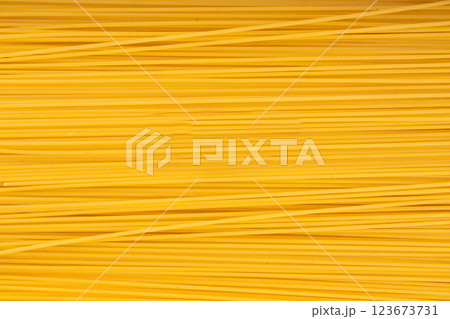 Raw spaghetti texture background, dry spagetti pattern, long wheat noodles banner Raw spaghetti texture background, dry spagetti pattern, long wheat noodles banner 123673731