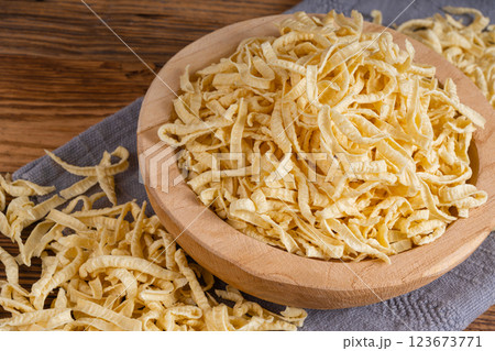 Passatelli spatzle pasta in bowl, raw spaetzle noodles, dry homemade german macaroni 123673771