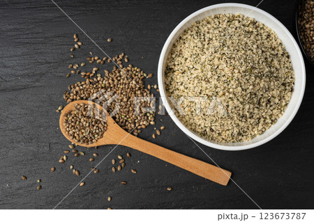Shelled hemp seeds pile, peeled cannabis grains, marijuana kernels without peel 123673787