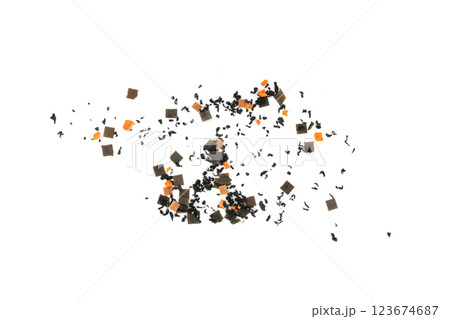 Dry kelp seaweed squares, mini wakame pieces isolated, dried kombu and carrot flakes from ramen Dry kelp seaweed squares, mini wakame pieces isolated, dried kombu and carrot flakes from ramen 123674687