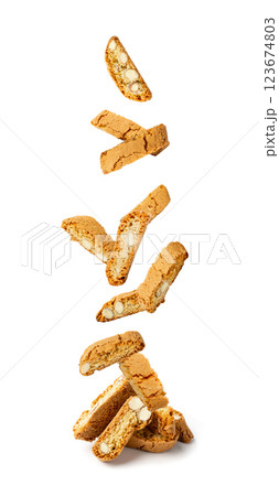Falling biscotti di prato isolated on white background. Flying italian cantuccini nuts cookies Falling biscotti di prato isolated on white background. Flying italian cantuccini nuts cookies 123674803