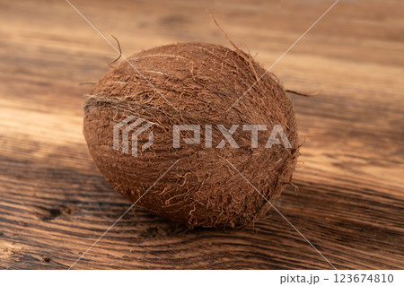 Whole coconut, one coco nut, single fresh tropical palm fruit, natural milk, oil ingredient 123674810