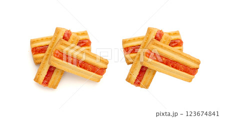 Shortbread sticks with a jam strip isolated, biscuit cookies with fruit marmalade or jelly on white 123674841