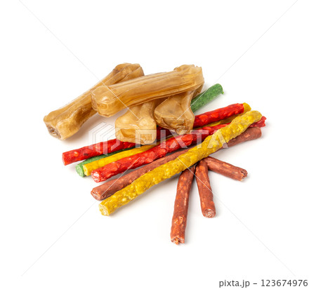 Rawhide chew sticks for dogs, colorful collagen dog food, pressed dry kibble, dental care treats Rawhide chew sticks for dogs, colorful collagen dog food, pressed dry kibble, dental care treats 123674976