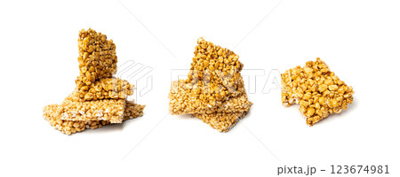 Puffed rice bar isolated, sweet wheat kozinaki, puff cereal block pieces, sugar crispy wheat bar, healthy popped dessert Puffed rice bar isolated, sweet wheat kozinaki, puff cereal block pieces, sugar crispy wheat bar, healthy popped dessert 123674981