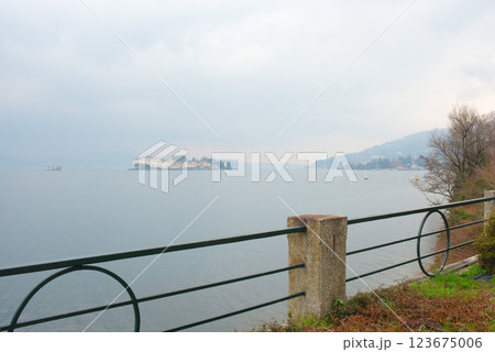 Beautiful aerial view of Lake Maggiore among the mountains, Italy. Island of Isola Bella. Morning mist. 123675006