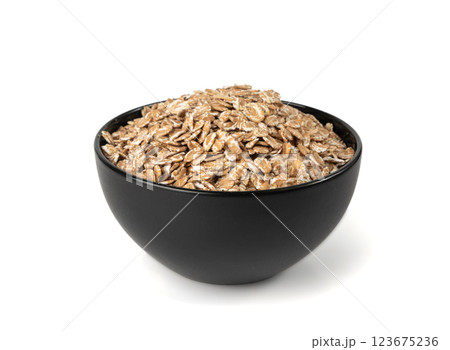Spelt flakes isolated, dry raw rolled flat oat grains, wheat, oatmeal or bran, barley rye cereals Spelt flakes isolated, dry raw rolled flat oat grains, wheat, oatmeal or bran, barley rye cereals 123675236