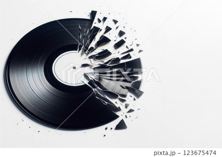 A broken vinyl record on a light background. Space for text. A broken vinyl record on a light background. Space for text. 123675474