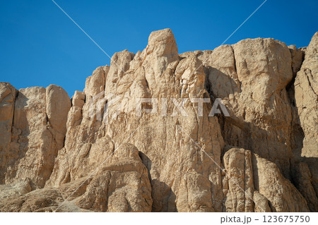 Yellow rocks near the walls of the ancient temple of Hatshepsut Yellow rocks near the walls of the ancient temple of Hatshepsut 123675750