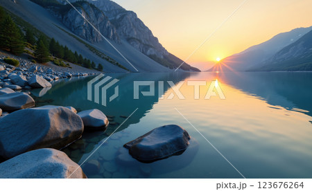 Serene sunrise over calm lake. 123676264