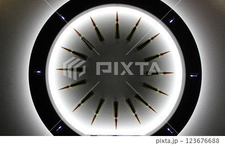 Perfect Circle Made Of Bullets With Soft Backlight From Ring Lamp  123676688