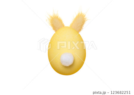 PNG, Easter, yellow egg with rabbit tail and ears, isolated on white background PNG, Easter, yellow egg with rabbit tail and ears, isolated on white background 123682251