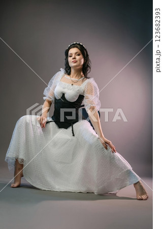 Elegant woman in corset and lingerie showcasing beauty and fashion trends 123682393