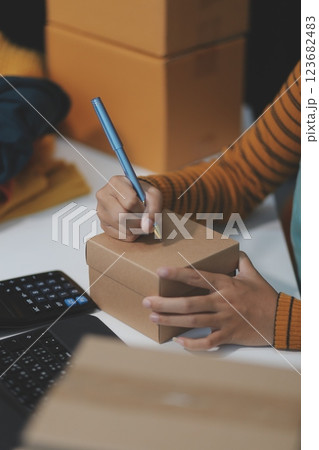 vlogger, blogger small SME business asian beautiful woman using mobile phone video call for sell clothes live stream selling online, show product present detail at home office, entrepreneur ecommerce vlogger, blogger small SME business asian beautiful woman using mobile phone video call for sell clothes live stream selling online, show product present detail at home office, entrepreneur ecommerce 123682483