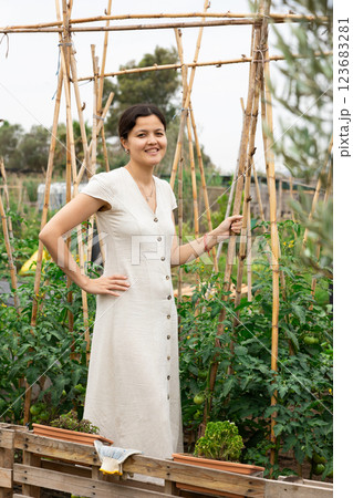 Asian woman at vegetable garden Asian woman at vegetable garden 123683281