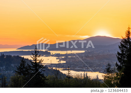 Burnaby Mountain Park in sunset time. Overlooking the upper arms of Burrard Inlet. Burnaby, BC, Canada. Burnaby Mountain Park in sunset time. Overlooking the upper arms of Burrard Inlet. Burnaby, BC, Canada. 123684433