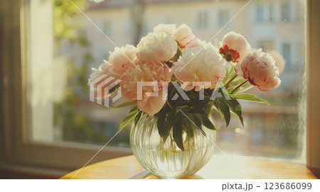 Freshly cut peonies arranged in a luxurious bouquet , flower arrangement, wedding decoration, high end. Freshly cut peonies arranged in a luxurious bouquet , flower arrangement, wedding decoration, high end. 123686099