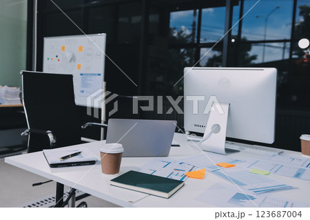 Entrepreneur Asian businessman and businesswoman discussing new business project in tablet in modern Meeting In Modern Office, Asian business casual concept. 123687004