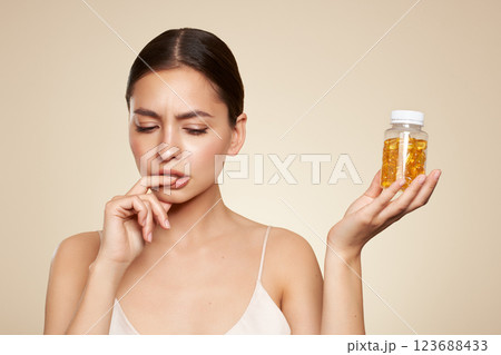 Beautiful Girl With Pill With Cod Liver Oil Omega-3 123688433