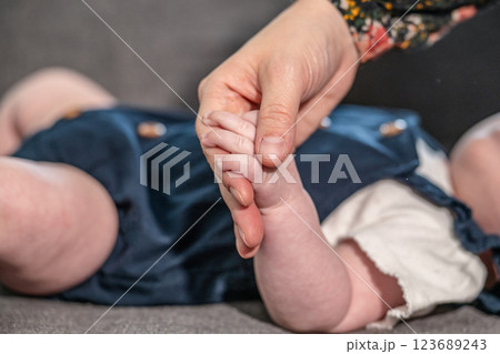 sweet tiny new born baby hand hold mum index finger. concept relationship between mother or parants and baby sweet tiny new born baby hand hold mum index finger. concept relationship between mother or parants and baby 123689243