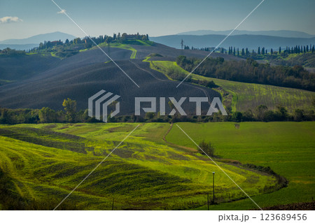 Rolling hills and vibrant fields in picturesque autumn countryside landscape Rolling hills and vibrant fields in picturesque autumn countryside landscape 123689456