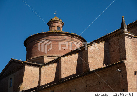 Historic brick church facade with clear sky and architectural details Historic brick church facade with clear sky and architectural details 123689461