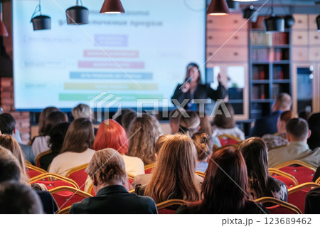 Audience attentively listening to presenter during educational business seminar 123689462
