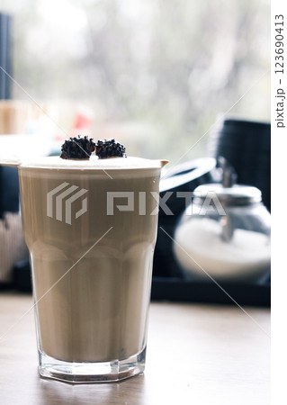 a cup of coffee a coffee horn with natural ground coffee and temper on a white background close-up a cup of coffee a coffee horn with natural ground coffee and temper on a white background close-up 123690413