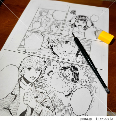 つけペンを使用したペン入れ作業中の漫画原稿の写真 漫画原稿制作中 つけペンを使用したペン入れ作業中の漫画原稿の写真 漫画原稿制作中 123690518