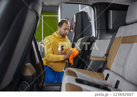 Service master working at car wash service Service master working at car wash service 123692887