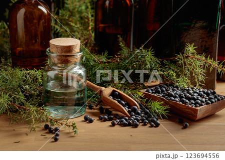 Juniper tincture with berries and branches. Juniper tincture with berries and branches. 123694556