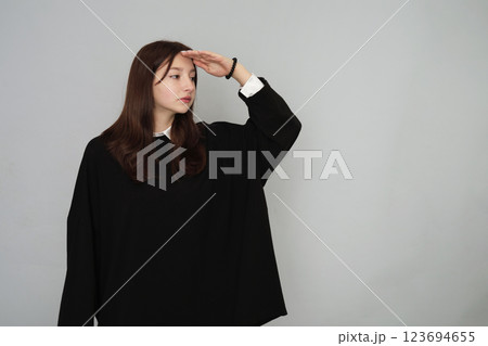 Stylish 16-year-old in a sleek black hoodie, perfect for youth advertising and versatile branding options 123694655