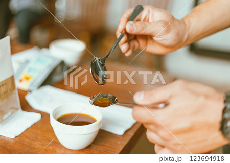 Barista preparing to test and inspecting the quality of coffee 123694918