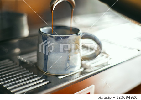 Close up of coffee machine pouring espresso in cafe Close up of coffee machine pouring espresso in cafe 123694920