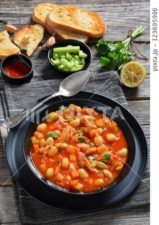 Pasulj, white bean soup with chicken in bowl 123695986