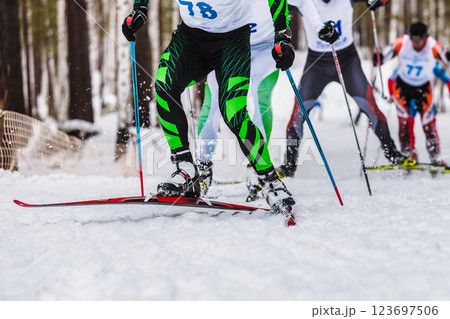 group ski athletes uphill in cross-country skiing race 123697506