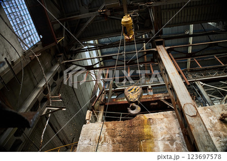 Industrial crane hook, abandoned factory Industrial crane hook, abandoned factory 123697578